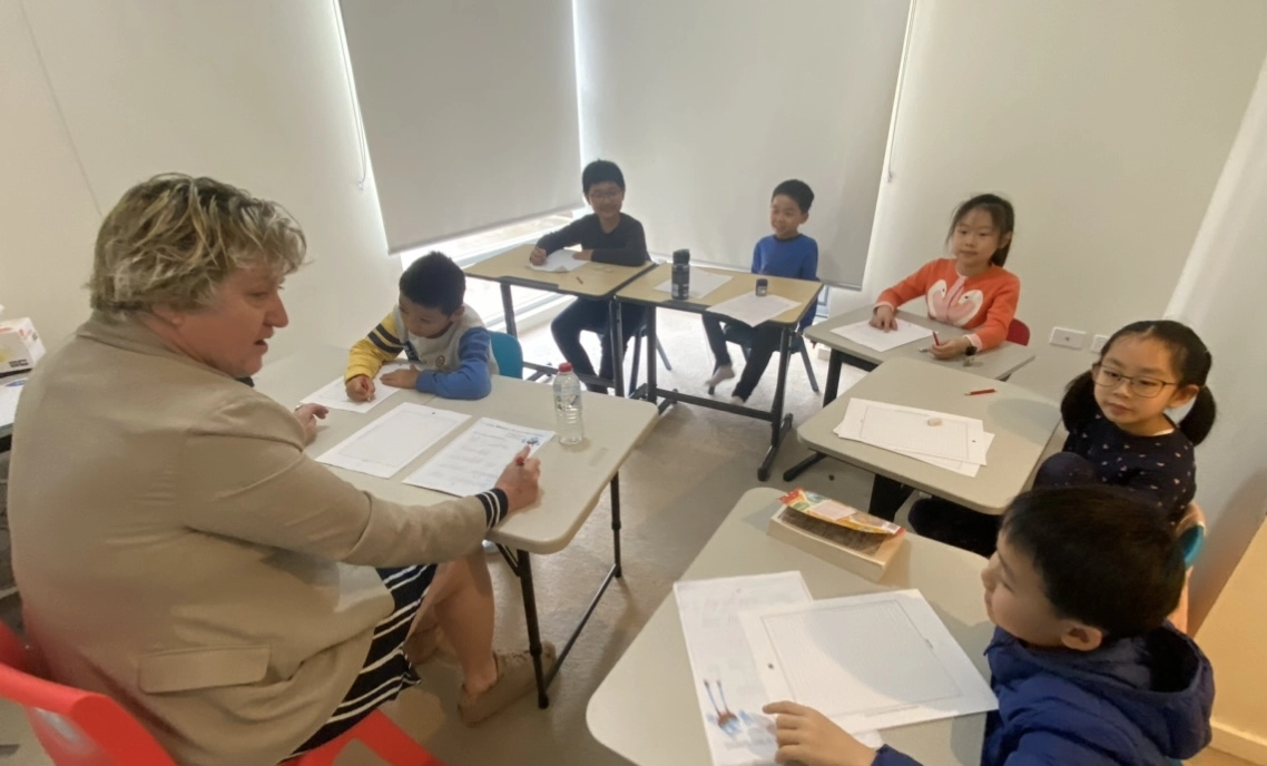 Kids learning with a teacher.
