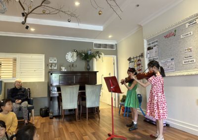 Kids playing music in a room.