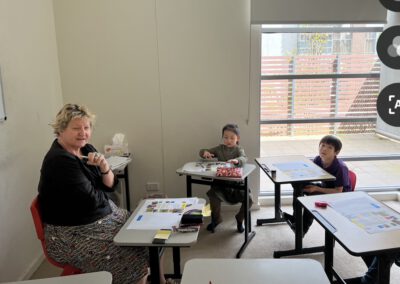 A teacher in a classroom with students.