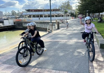 Kids riding bikes together.