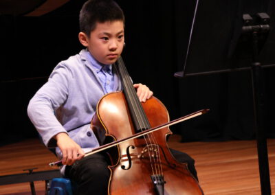 A boy playing an instrument.